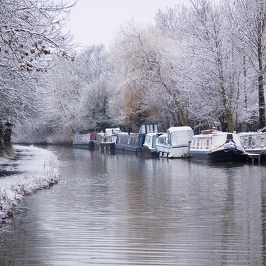 narrowboats riverboats on canal in winter