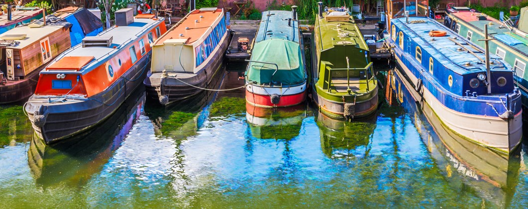 Narrowboats moored alongside each other