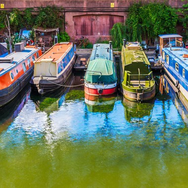 Narrowboats moored alongside each other