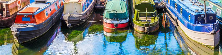 Narrowboats moored alongside each other