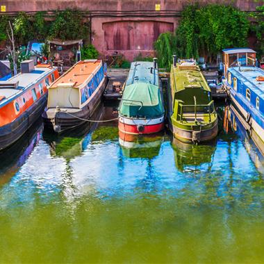 Narrowboats moored alongside each other